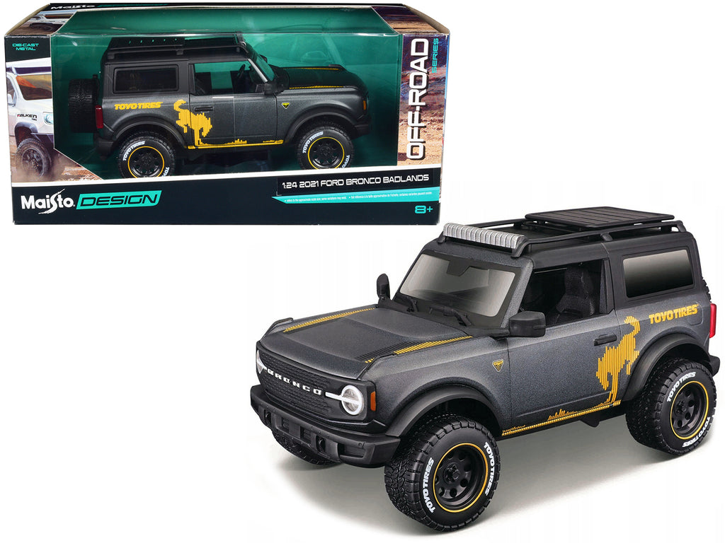 2021 Ford Bronco Badlands Dark Gray Metallic with Gold Graphics and Roof Rack 'Off-Road' 'Maisto Design' Series 1/24 Diecast Model Car by Maisto