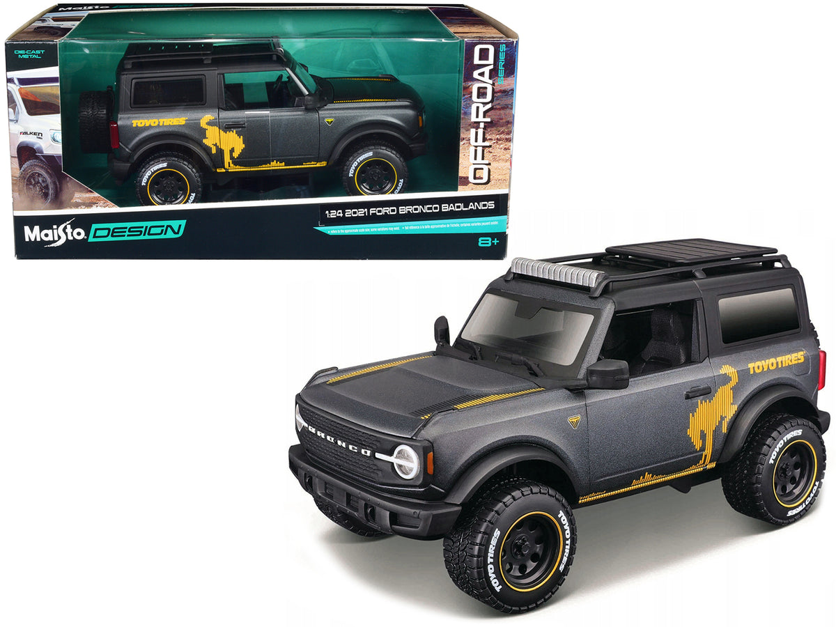 2021 Ford Bronco Badlands Dark Gray Metallic with Gold Graphics and Roof Rack 'Off-Road' 'Maisto Design' Series 1/24 Diecast Model Car by Maisto