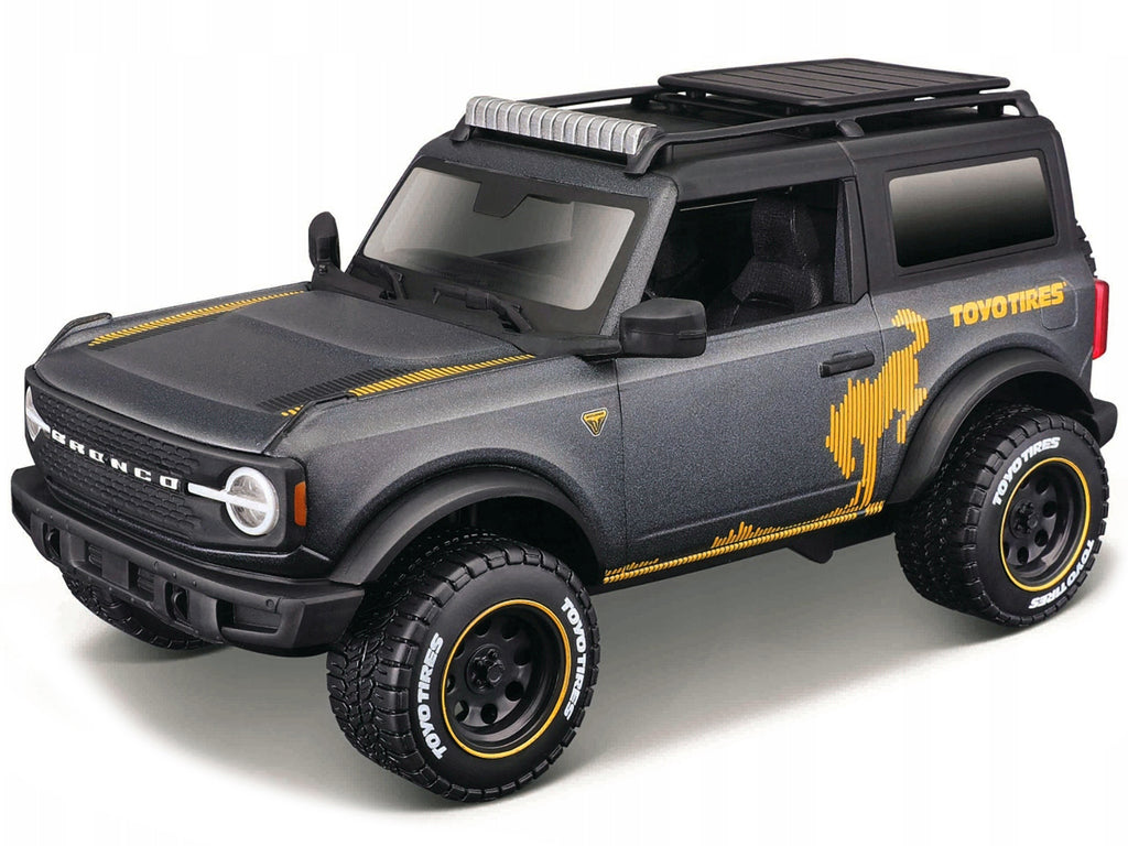 2021 Ford Bronco Badlands Dark Gray Metallic with Gold Graphics and Roof Rack 'Off-Road' 'Maisto Design' Series 1/24 Diecast Model Car by Maisto