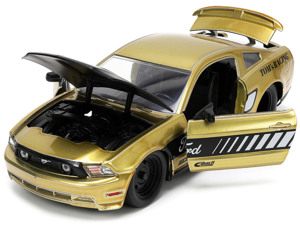 2010 Ford Mustang GT Gold Metallic with Black Graphics and Hood 'Tom's Racing' 'Bigtime Muscle' Series 1/24 Diecast Model Car by Jada