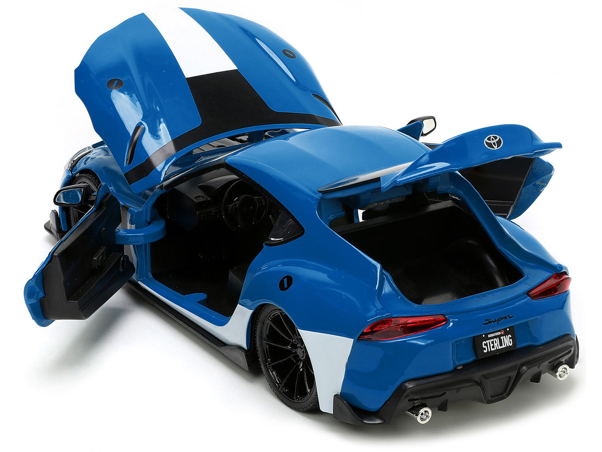 2020 Toyota Supra Blue with Graphics and Max Sterling Diecast Figurine 'Robotech' 'Hollywood Rides' Series 1/24 Diecast Model Car by Jada