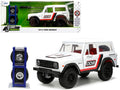 1973 Ford Bronco #008 White with Red and Black Stripes and Red Interior with Extra Wheels 'Just Trucks' Series 1/24 Diecast Model Car by Jada