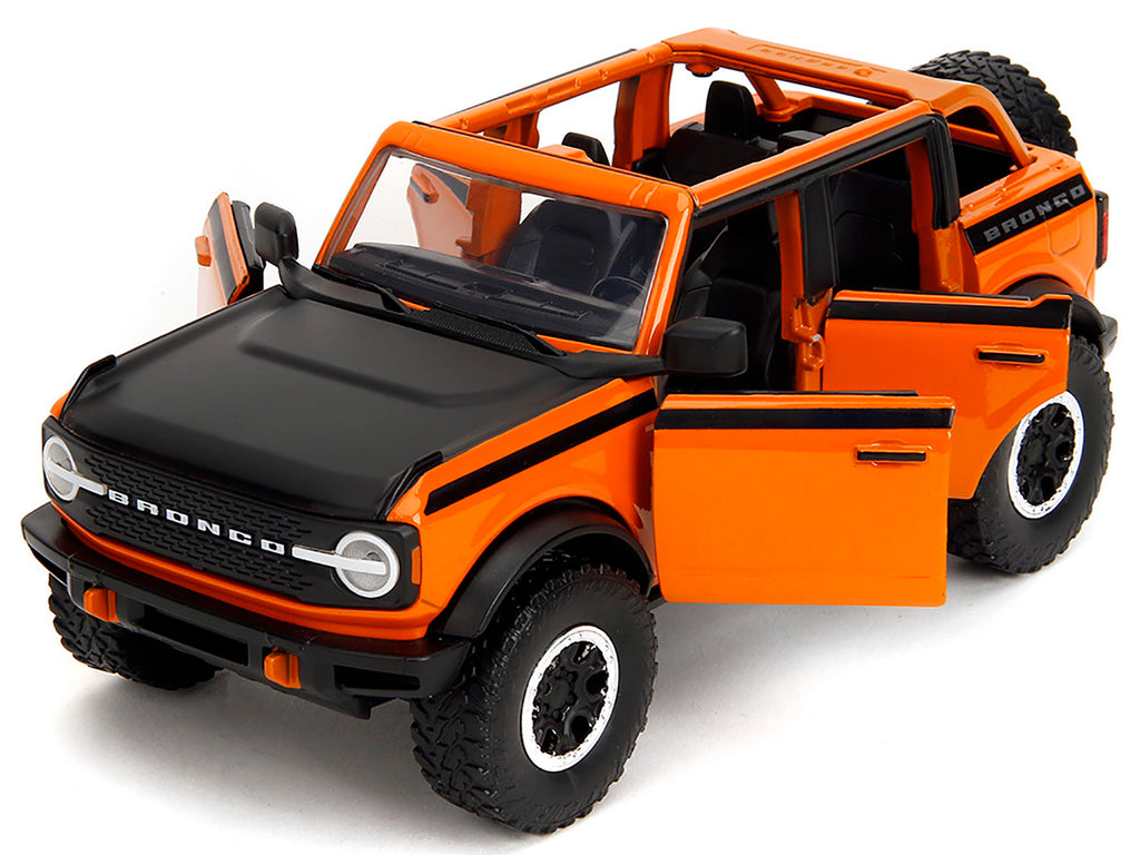 2021 Ford Bronco Open-Top Orange with Black Stripes and Hood with Extra Wheels 'Just Trucks' Series 1/24 Diecast Model Car by Jada