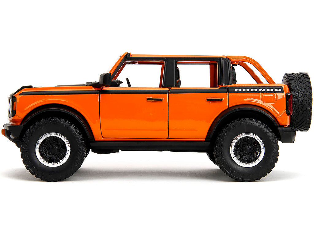 2021 Ford Bronco Open-Top Orange with Black Stripes and Hood with Extra Wheels 'Just Trucks' Series 1/24 Diecast Model Car by Jada