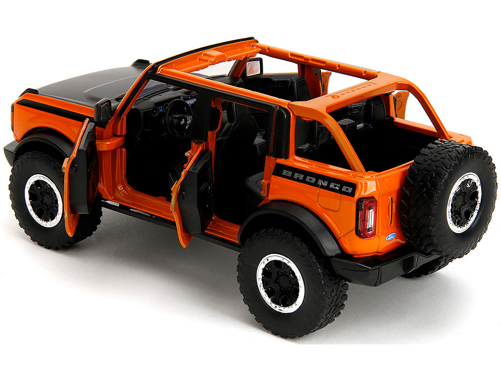2021 Ford Bronco Open-Top Orange with Black Stripes and Hood with Extra Wheels 'Just Trucks' Series 1/24 Diecast Model Car by Jada