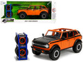 2021 Ford Bronco Open-Top Orange with Black Stripes and Hood with Extra Wheels 'Just Trucks' Series 1/24 Diecast Model Car by Jada
