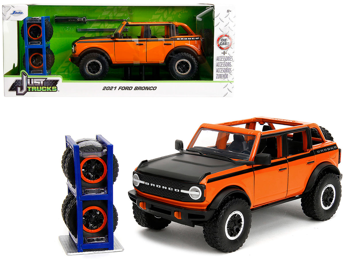 2021 Ford Bronco Open-Top Orange with Black Stripes and Hood with Extra Wheels 'Just Trucks' Series 1/24 Diecast Model Car by Jada