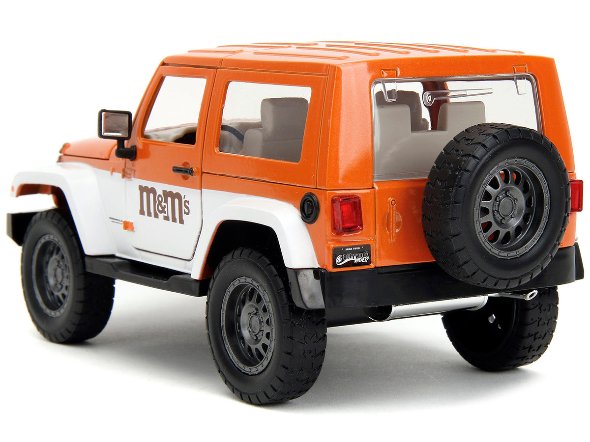 2007 Jeep Wrangler Orange Metallic and White and Orange M&M Diecast Figure 'M&M's' 'Hollywood Rides' Series 1/24 Diecast Model Car by Jada