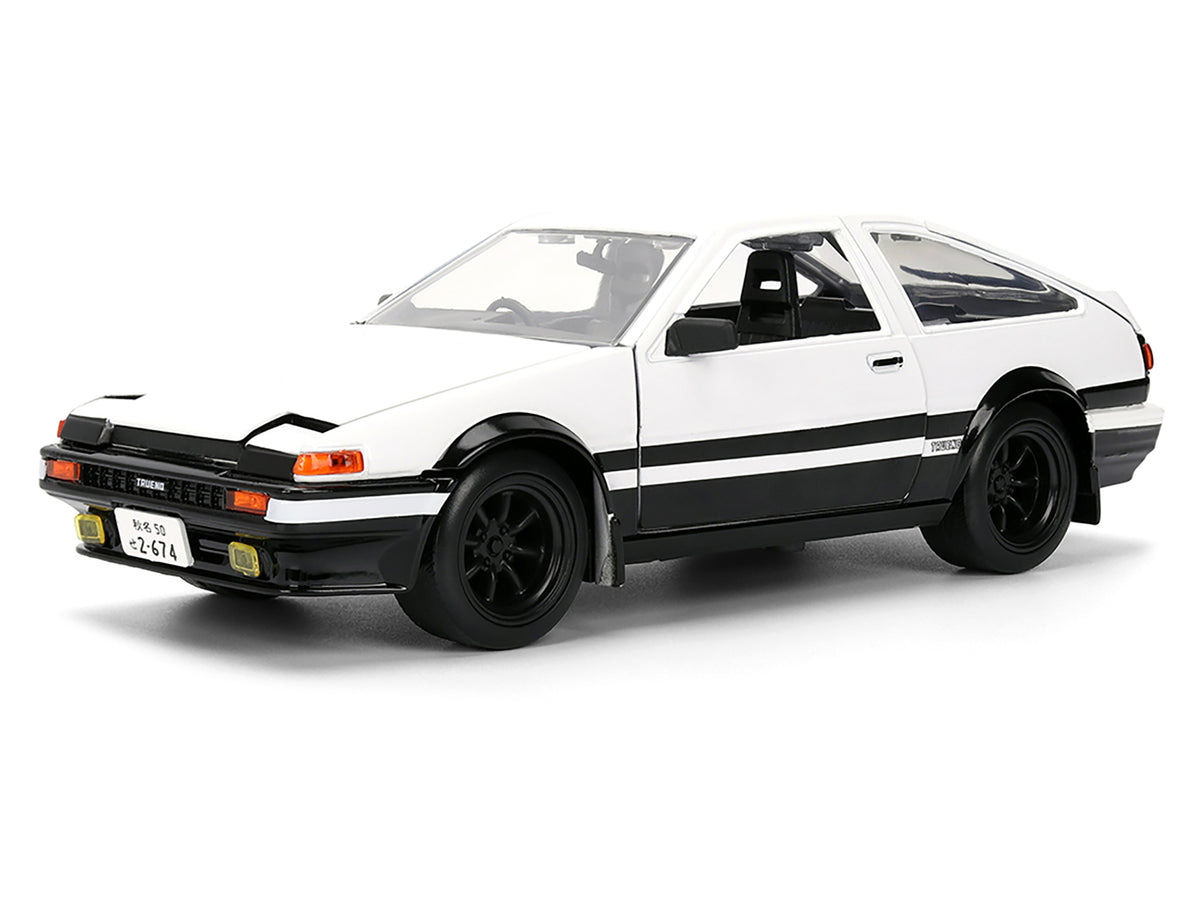 Toyota Trueno (AE86) RHD (Right Hand Drive) White and Black with Graphics and Takumi Diecast Figure 'Initial D' (1998-2021) TV Series 'Anime Hollywood Rides' Series 1/24 Diecast Model by Jada