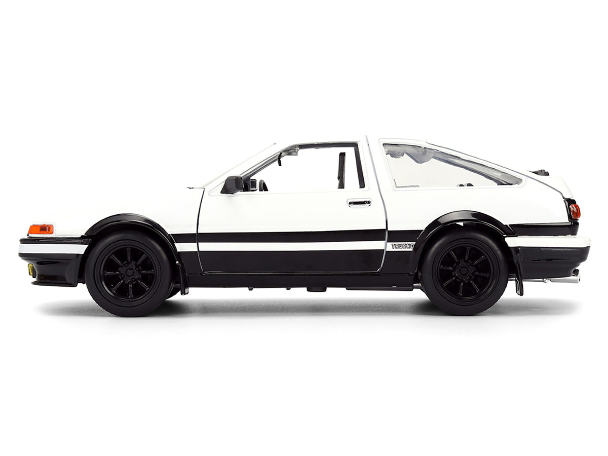 Toyota Trueno (AE86) RHD (Right Hand Drive) White and Black with Graphics and Takumi Diecast Figure 'Initial D' (1998-2021) TV Series 'Anime Hollywood Rides' Series 1/24 Diecast Model by Jada