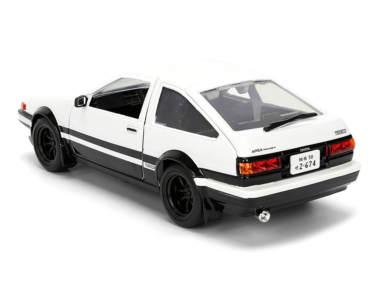 Toyota Trueno (AE86) RHD (Right Hand Drive) White and Black with Graphics and Takumi Diecast Figure 'Initial D' (1998-2021) TV Series 'Anime Hollywood Rides' Series 1/24 Diecast Model by Jada