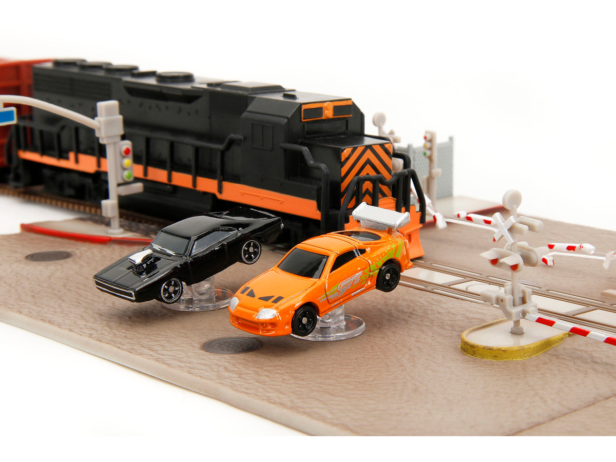 'Fast & Furious' Final Race Diorama with Toyota Supra Orange and Dodge Charger Black 'Nano Scene' Series model by Jada