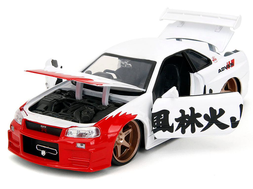 2002 Nissan Skyline GT-R (R34) RHD (Right Hand Drive) White with Red Graphics and Ryu Diecast Figure 'Street Fighter' Video Game 'Anime Hollywood Rides' Series 1/24 Diecast Model Car by Jada