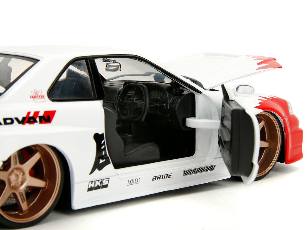 2002 Nissan Skyline GT-R (R34) RHD (Right Hand Drive) White with Red Graphics and Ryu Diecast Figure 'Street Fighter' Video Game 'Anime Hollywood Rides' Series 1/24 Diecast Model Car by Jada