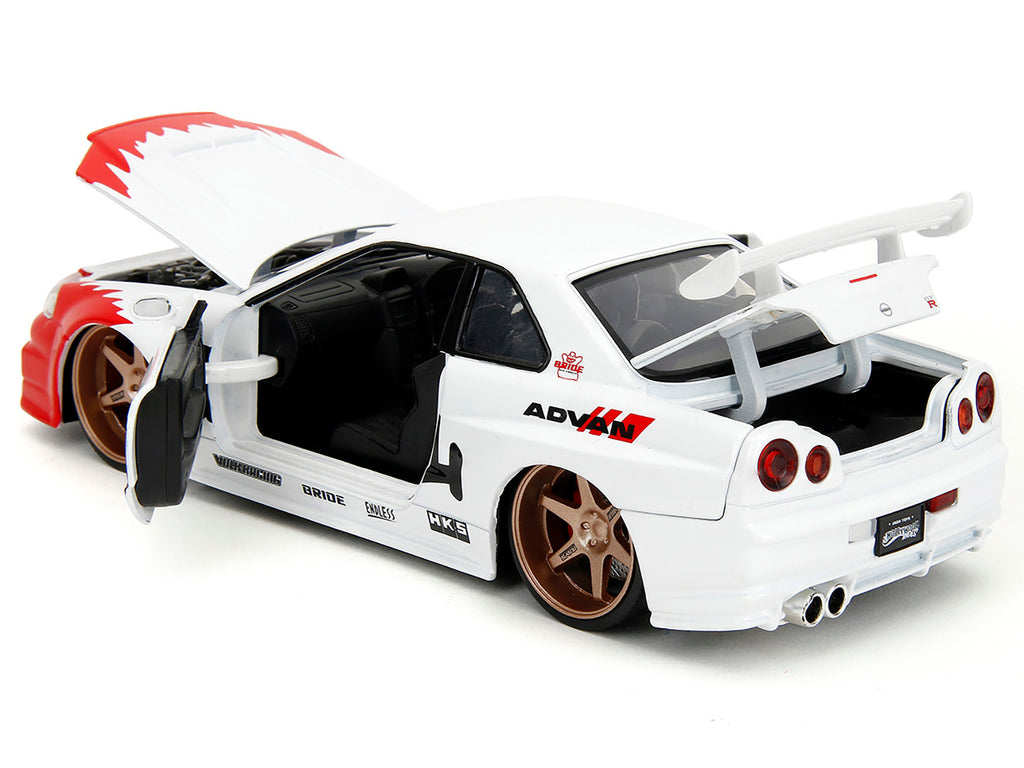 2002 Nissan Skyline GT-R (R34) RHD (Right Hand Drive) White with Red Graphics and Ryu Diecast Figure 'Street Fighter' Video Game 'Anime Hollywood Rides' Series 1/24 Diecast Model Car by Jada