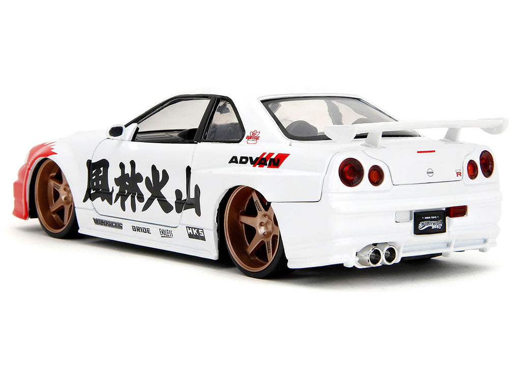 2002 Nissan Skyline GT-R (R34) RHD (Right Hand Drive) White with Red Graphics and Ryu Diecast Figure 'Street Fighter' Video Game 'Anime Hollywood Rides' Series 1/24 Diecast Model Car by Jada