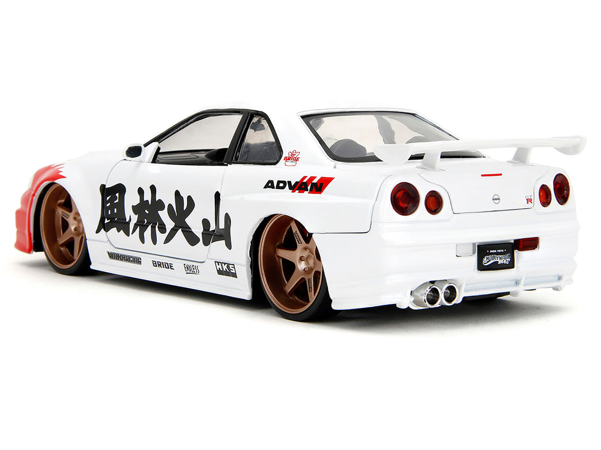 2002 Nissan Skyline GT-R (R34) RHD (Right Hand Drive) White with Red Graphics and Ryu Diecast Figure 'Street Fighter' Video Game 'Anime Hollywood Rides' Series 1/24 Diecast Model Car by Jada