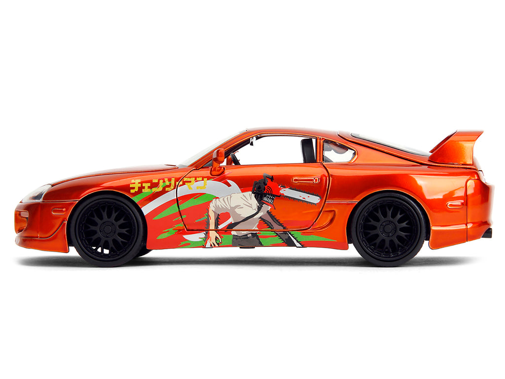 1995 Toyota Supra Orange Metallic with Graphics and Chainsaw Man Diecast Figure 'Chainsaw Man' (2022) TV Series 'Anime Hollywood Rides' Series 1/24 Diecast Model by Jada