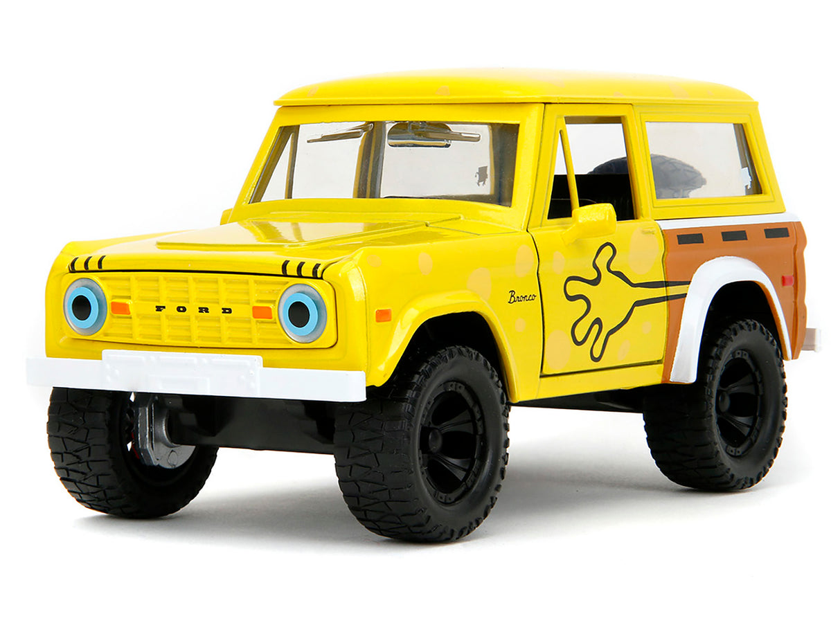 1973 Ford Bronco Yellow with Graphics and SpongeBob SquarePants Diecast Figure 'SpongeBob SquarePants' (1999–Current) TV Series 'Hollywood Rides' Series 1/24 Diecast Model Car by Jada
