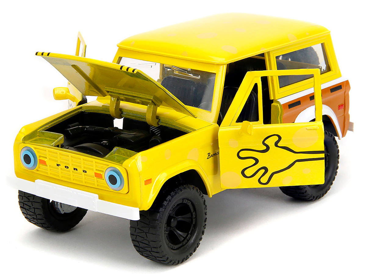 1973 Ford Bronco Yellow with Graphics and SpongeBob SquarePants Diecast Figure 'SpongeBob SquarePants' (1999–Current) TV Series 'Hollywood Rides' Series 1/24 Diecast Model Car by Jada
