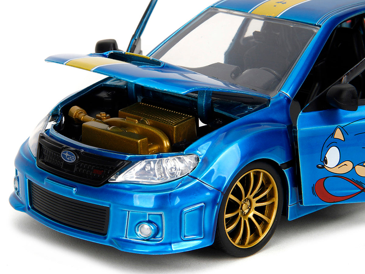 2012 Subaru Impreza WRX STI Blue Metallic with Graphics and Sonic The Hedgehog Diecast Figure 'Sonic The Hedgehog' 'Hollywood Rides' Series 1/24 Diecast Model Car by Jada