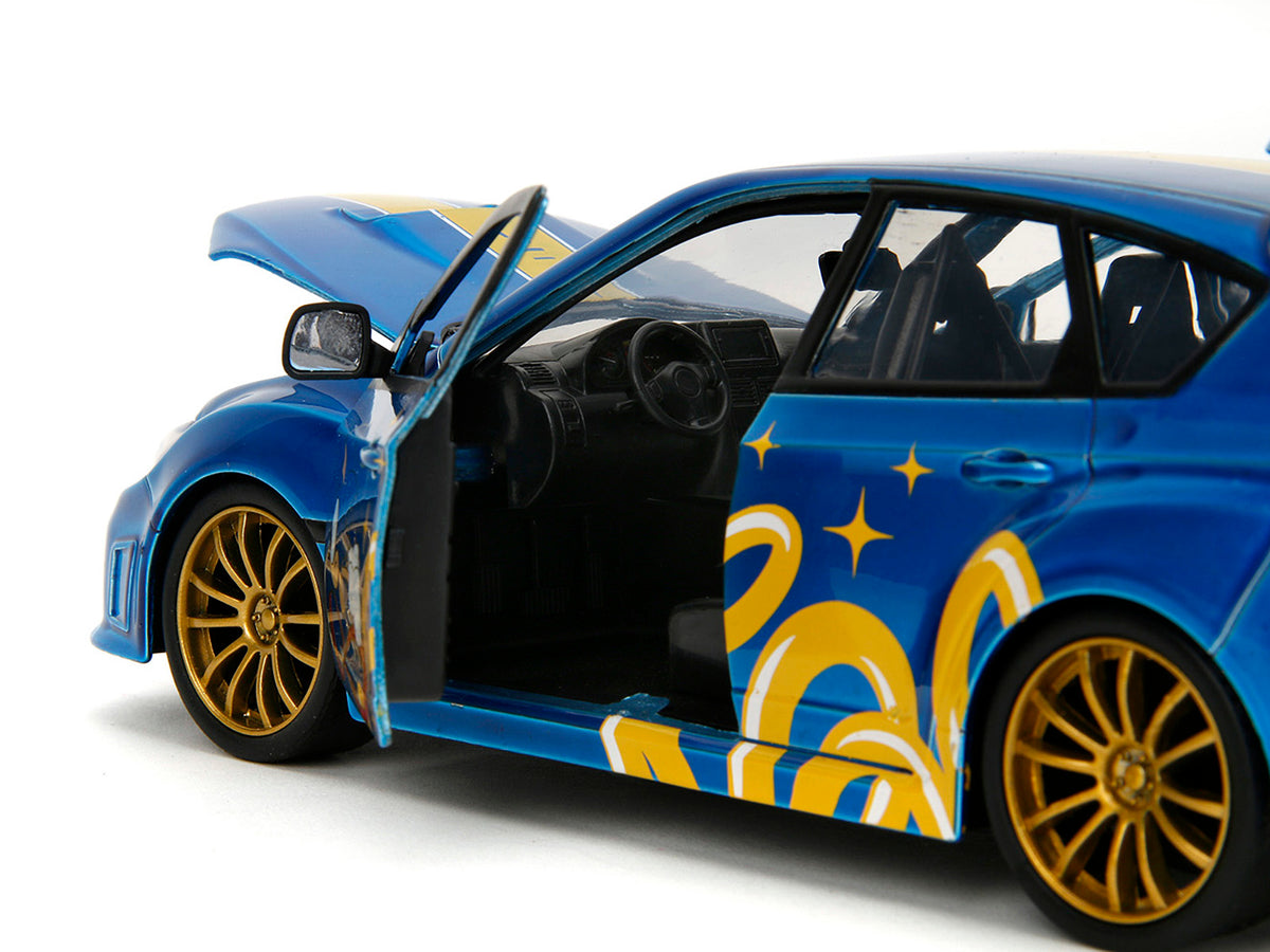 2012 Subaru Impreza WRX STI Blue Metallic with Graphics and Sonic The Hedgehog Diecast Figure 'Sonic The Hedgehog' 'Hollywood Rides' Series 1/24 Diecast Model Car by Jada