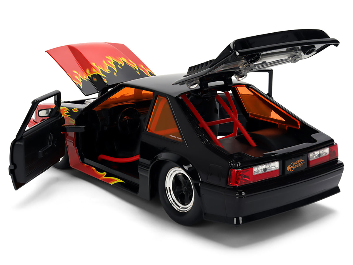 1989 Ford Mustang GT Black with Red Flame Graphics and Chester Cheetah Diecast Figure 'Cheetos Flamin' Hot' 'Hollywood Rides' Series 1/24 Diecast Model Car by Jada