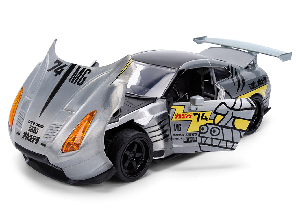 2009 Nissan GT-R (R35) Ben Sopra Brushed Metal with Black Top and Graphics and Mechagodzilla Diecast Figure 'Godzilla' Franchise 'Anime Hollywood Rides' Series 1/24 Diecast Model by Jada