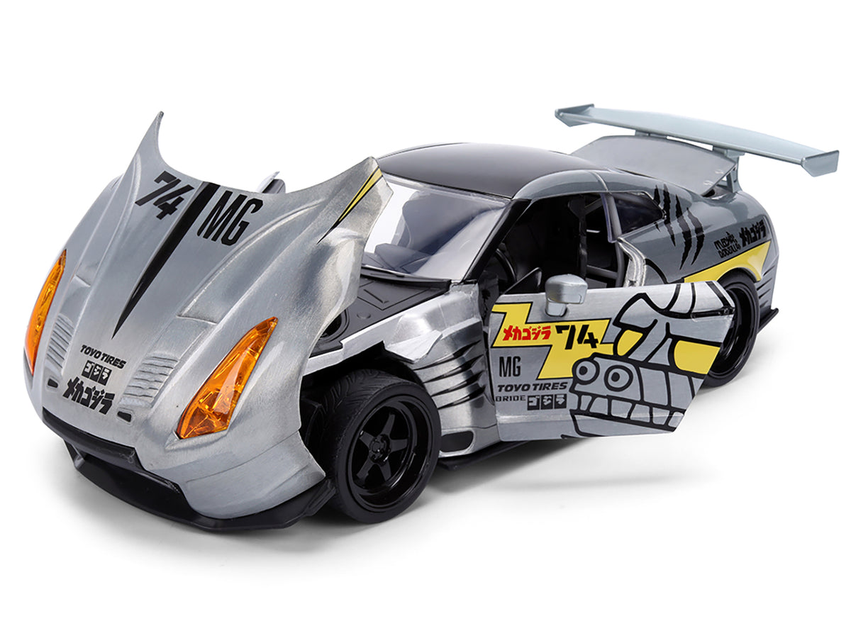 2009 Nissan GT-R (R35) Ben Sopra Brushed Metal with Black Top and Graphics and Mechagodzilla Diecast Figure 'Godzilla' Franchise 'Anime Hollywood Rides' Series 1/24 Diecast Model by Jada