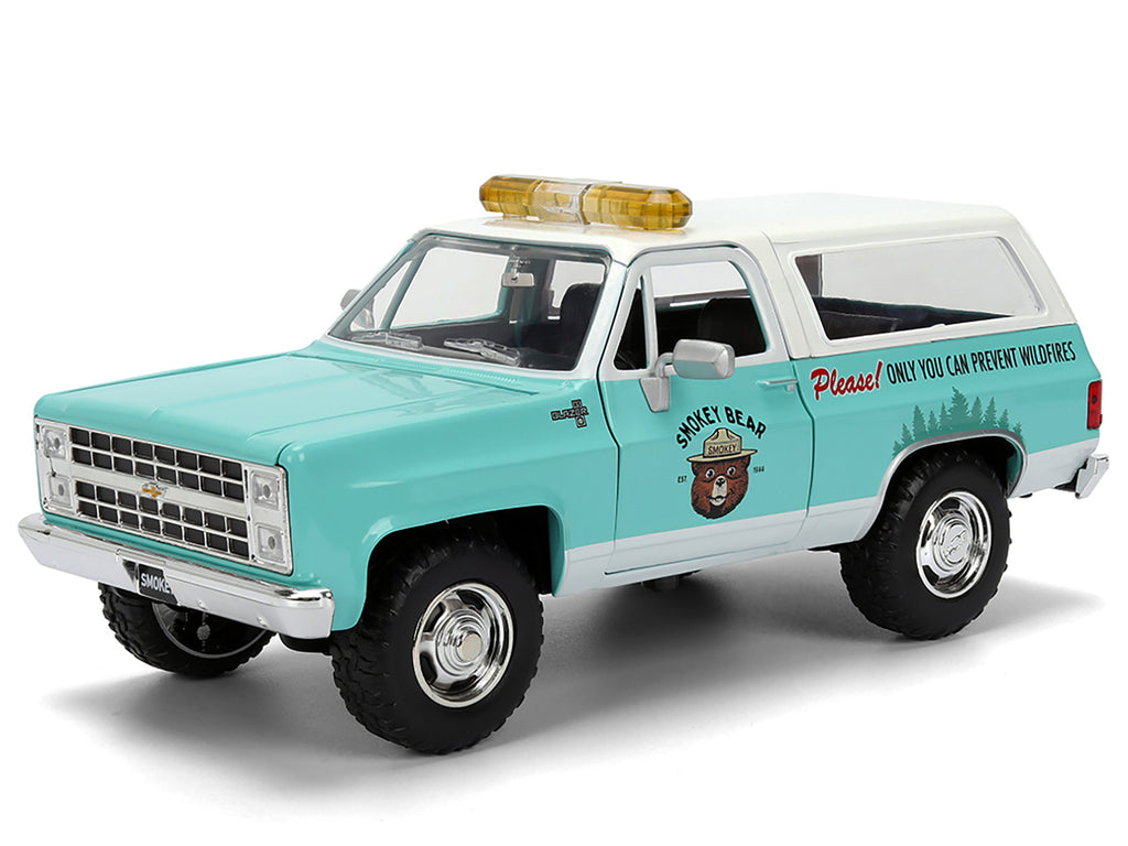 1980 Chevrolet Blazer Light Green with White Top and Graphics and Smokey Bear Diecast Figure 'Smokey Bear' 'Hollywood Rides' Series 1/24 Diecast Model by Jada