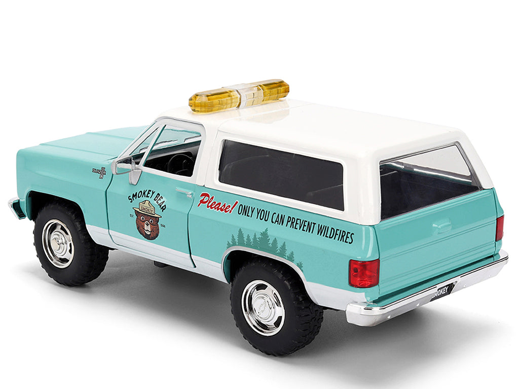1980 Chevrolet Blazer Light Green with White Top and Graphics and Smokey Bear Diecast Figure 'Smokey Bear' 'Hollywood Rides' Series 1/24 Diecast Model by Jada