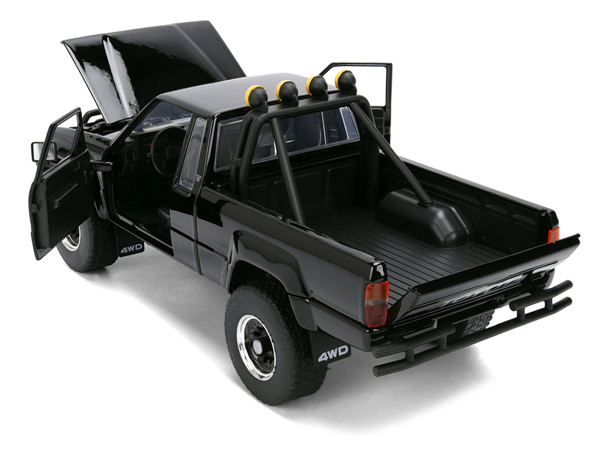 1985 Toyota SR5 Pickup Truck Black with Marty's Skateboard 'Back to the Future' (1985) Movie 'Hollywood Rides' Series 1/24 Diecast Model Car by Jada