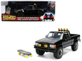 1985 Toyota SR5 Pickup Truck Black with Marty's Skateboard 'Back to the Future' (1985) Movie 'Hollywood Rides' Series 1/24 Diecast Model Car by Jada