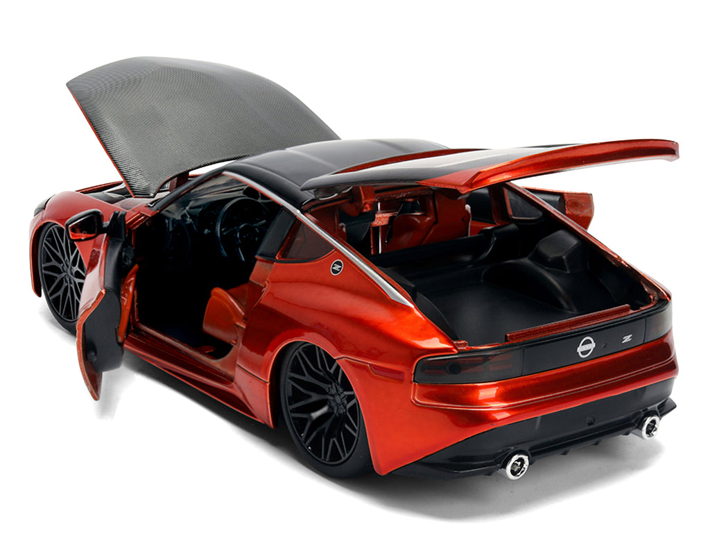 2023 Nissan Z Orange Metallic with Carbon Hood and Black Top 'JDM Tuners' Series 1/24 Diecast Model Car by Jada
