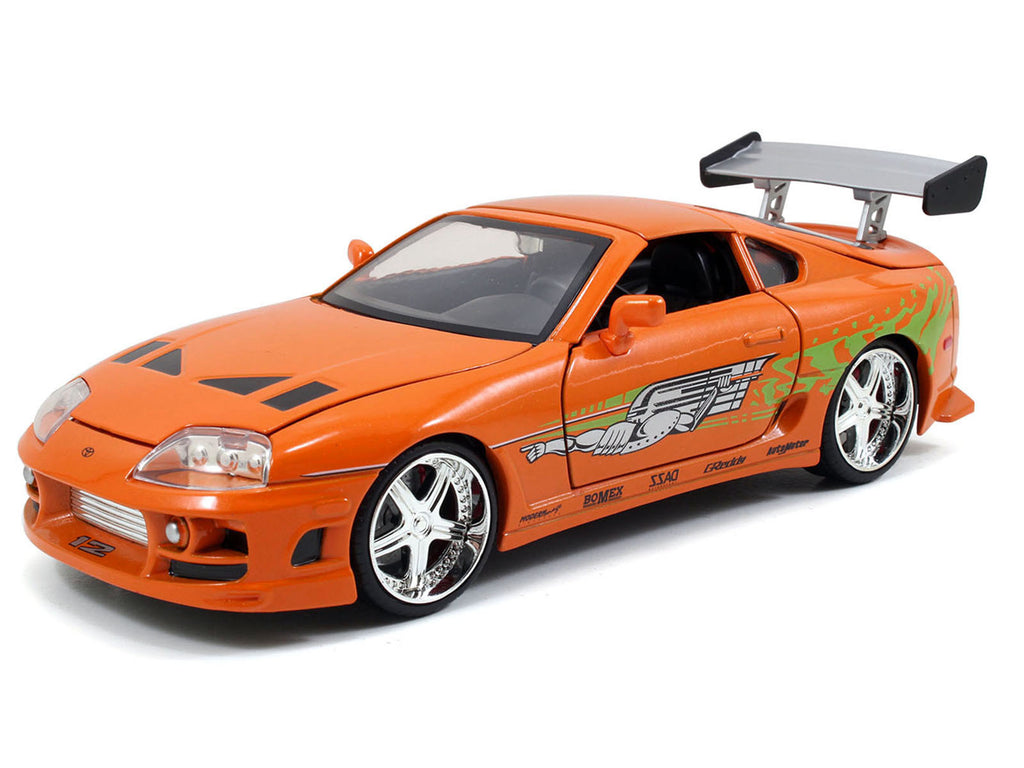 Dom's 1970 Dodge Charger R/T Black and Brian's Toyota Supra Orange with Graphics Set of 2 Cars 'Fast & Furious 25th Anniversary' 'Fast & Furious' Series 1/24 Diecast Model Cars by Jada