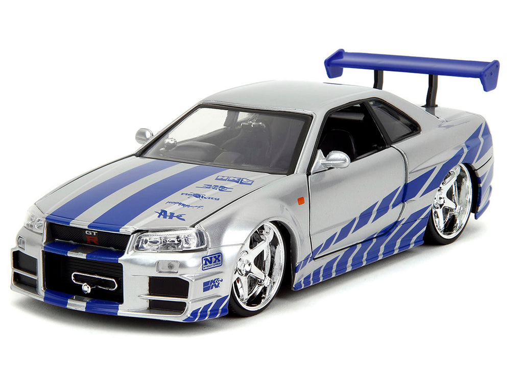 Brian's Nissan Skyline GT-R (R34) Silver Metallic with Blue Stripes and Suki's Honda S2000 Pink with Graphics Set of 2 Cars 'Fast & Furious 25th Anniversary' 'Fast & Furious' Series 1/24 Diecast Model Cars by Jada