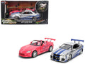 Brian's Nissan Skyline GT-R (R34) Silver Metallic with Blue Stripes and Suki's Honda S2000 Pink with Graphics Set of 2 Cars 'Fast & Furious 25th Anniversary' 'Fast & Furious' Series 1/24 Diecast Model Cars by Jada