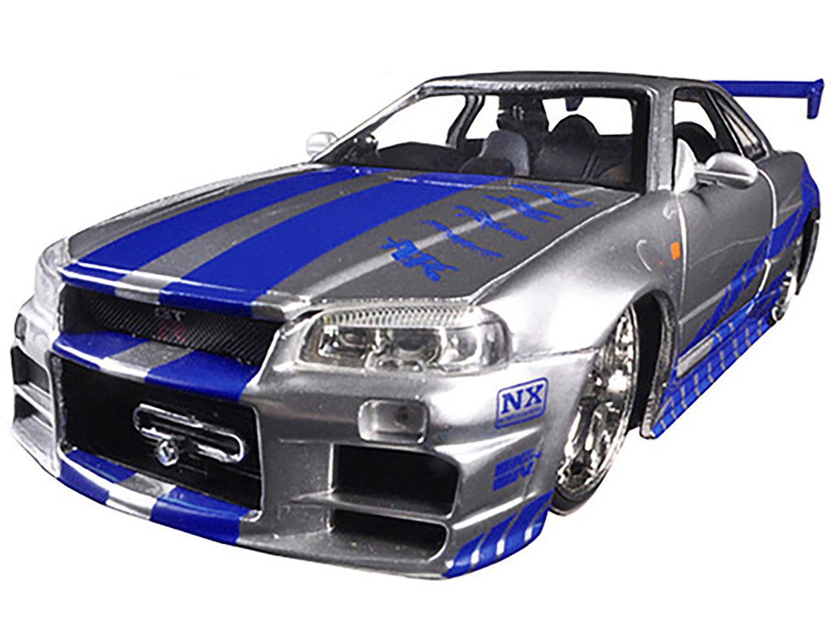 Brian's Nissan GTR Skyline R34 RHD (Right Hand Drive) Silver with Blue Stripes 'Fast & Furious 25th Anniversary' 1/24 Diecast Model Car by Jada