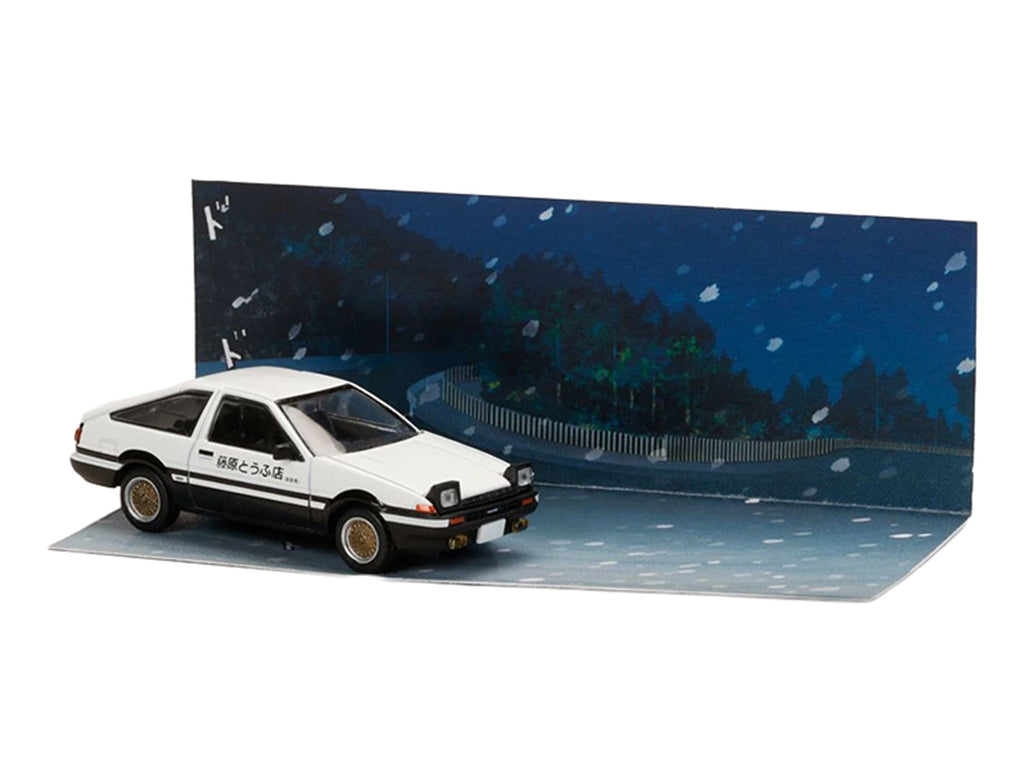 Toyota Sprinter Trueno (AE86) RHD (Right Hand Drive) White with Black Stripes 'Takumi Fujiwara & Natsuki Mogi - Initial D' (1995-2013) Manga 'Diorama Set Series' 1/64 Diecast Model Car by Hobby Japan