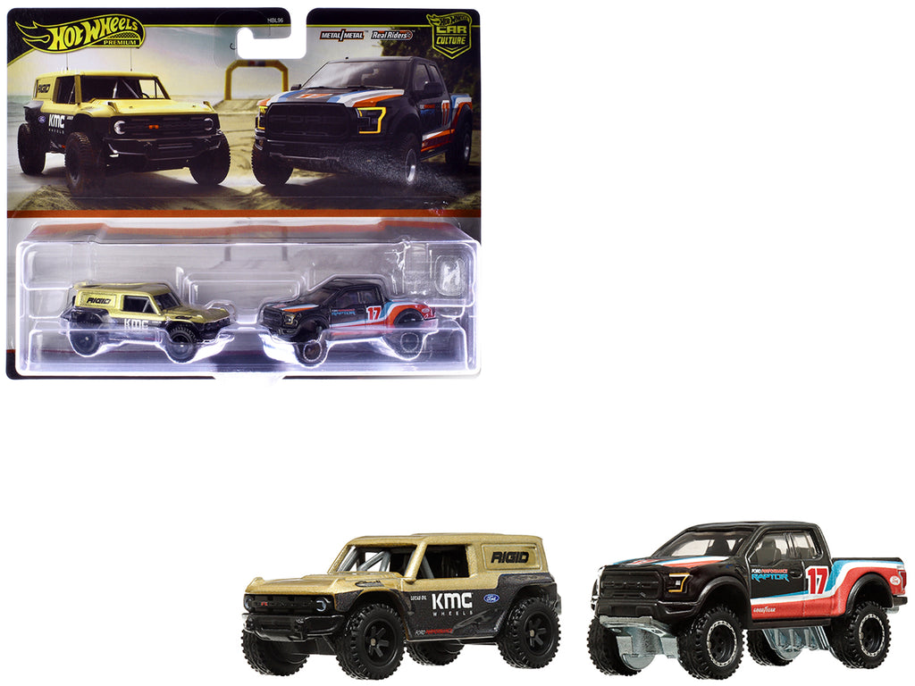 Ford Bronco R Gold Metallic and Black and 2017 Ford F-150 Raptor Pickup Truck #17 Black with Stripes 'Car Culture' Set of 2 Cars Diecast Model Cars by Hot Wheels