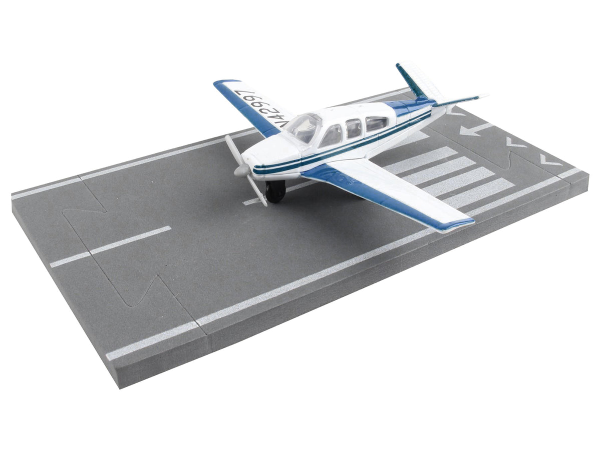Beechcraft Bonanza Aircraft White with Blue Stripes 'N42997' with Runway Section Diecast Model Airplane by Runway24