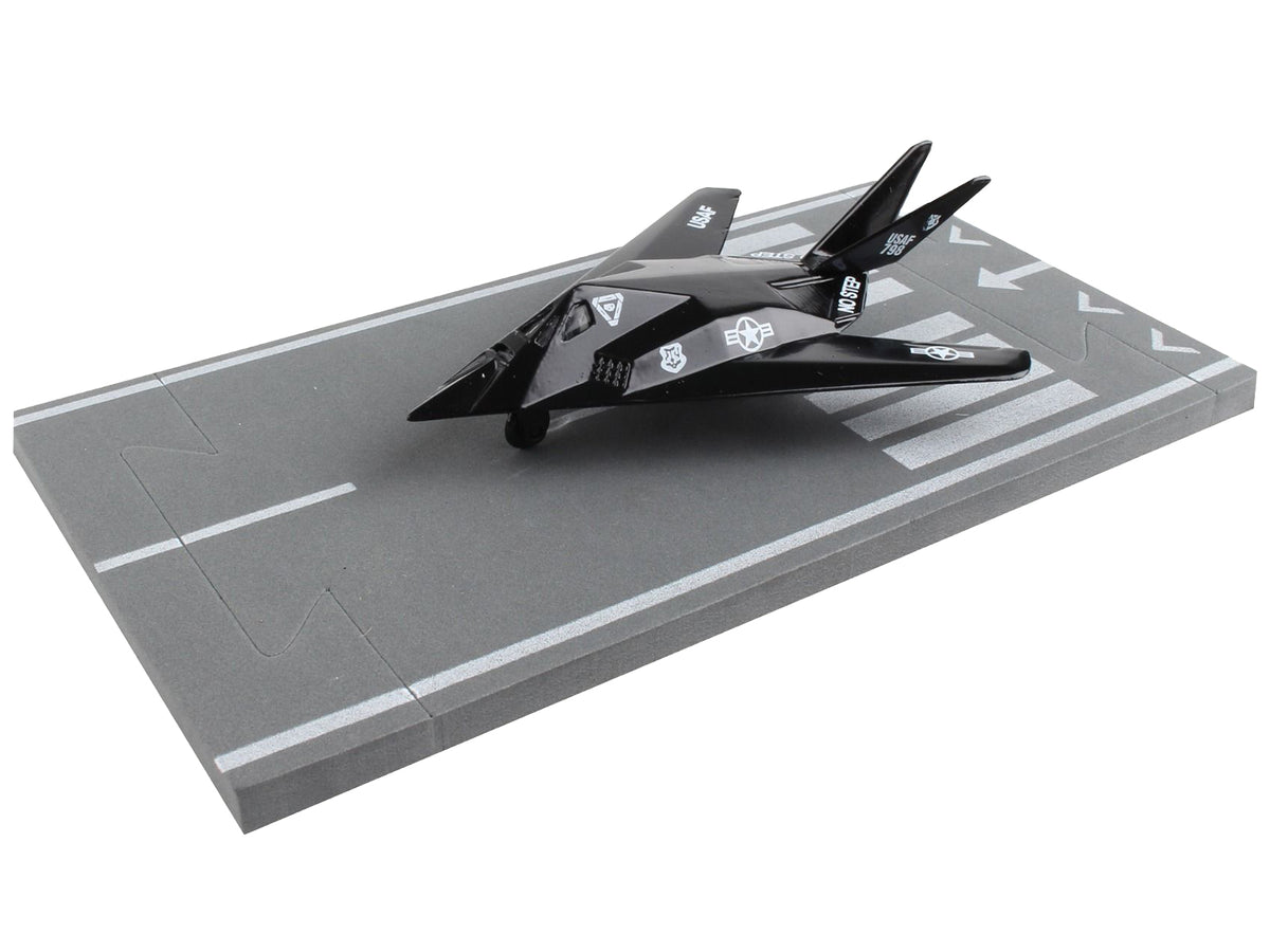 Lockheed F-117 Nighthawk Stealth Aircraft Black 'United States Air Force' with Runway Section Diecast Model Airplane by Runway24