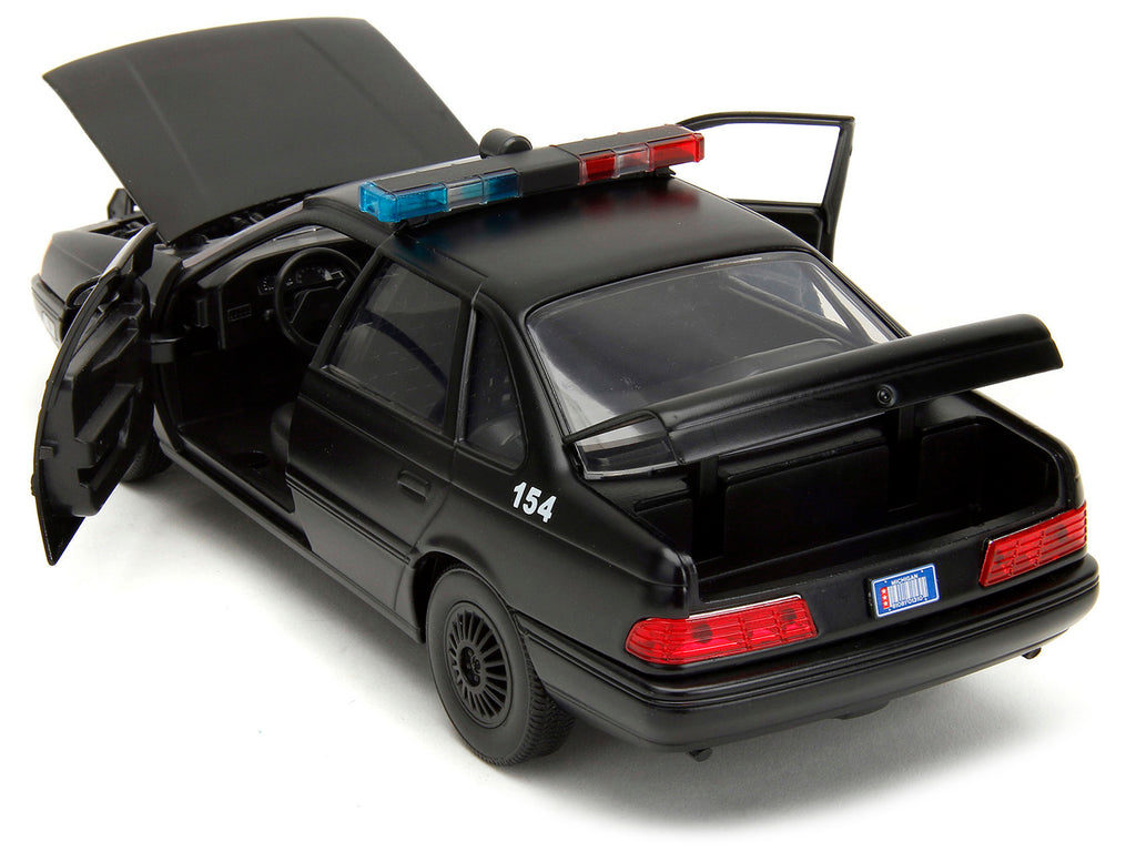 Ford Taurus OCP Matt Black 'Detroit Police' and Robocop Diecast Figure 35th Anniversary 'Robocop' (1987) Movie 'Hollywood Rides' Series 1/24 Diecast Model Car by Jada