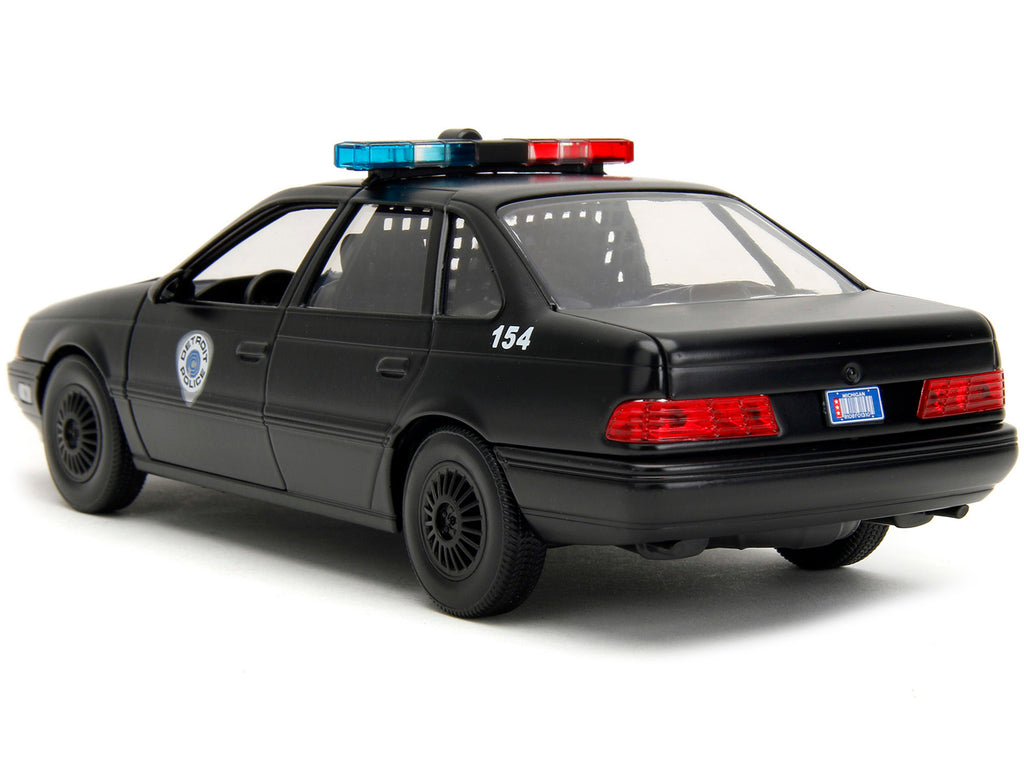 Ford Taurus OCP Matt Black 'Detroit Police' and Robocop Diecast Figure 35th Anniversary 'Robocop' (1987) Movie 'Hollywood Rides' Series 1/24 Diecast Model Car by Jada