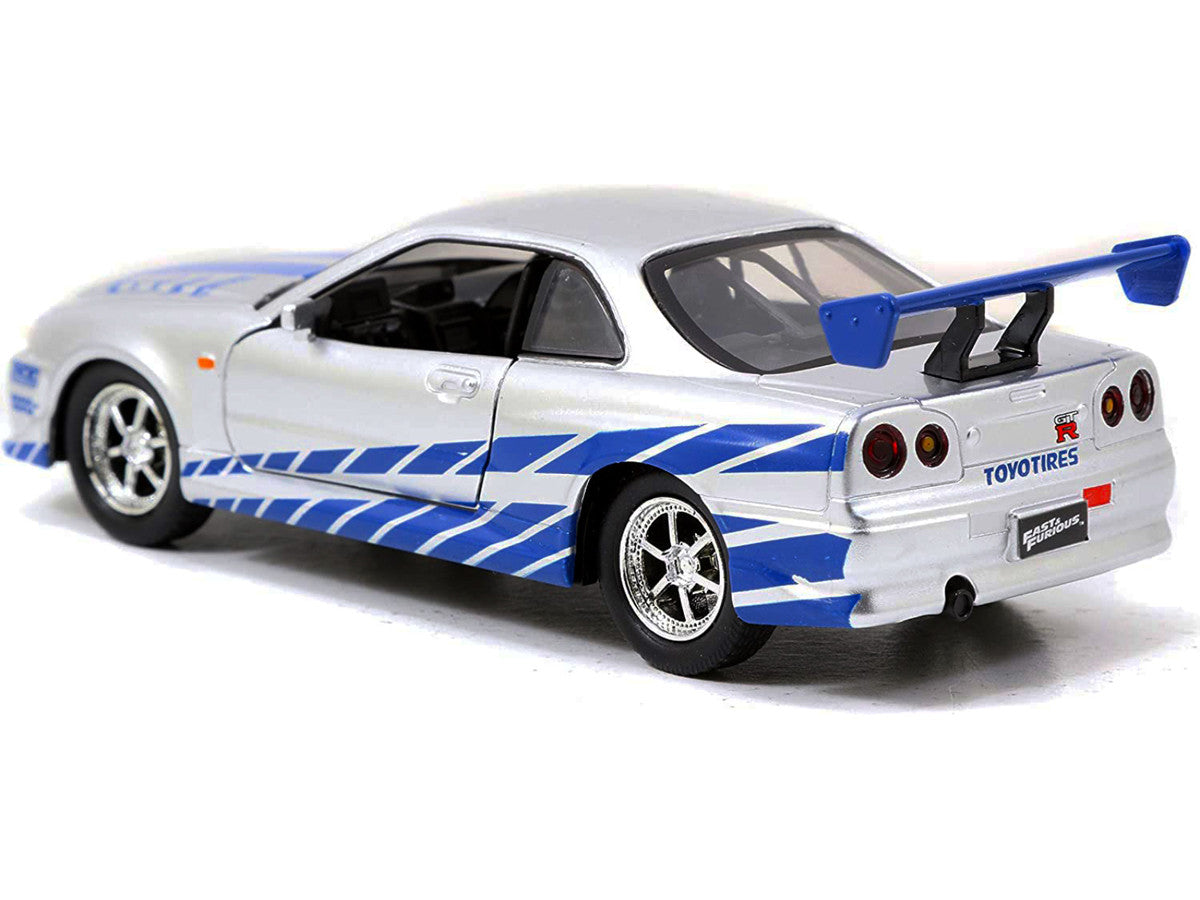 Brian's Nissan Skyline GT-R (R34) RHD (Right Hand Drive) Silver Metallic with Blue Stripes '2 Fast 2 Furious' (2003) Movie 'Fast & Furious 25th Anniversary' Series 1/32 Diecast Car Model by Jada